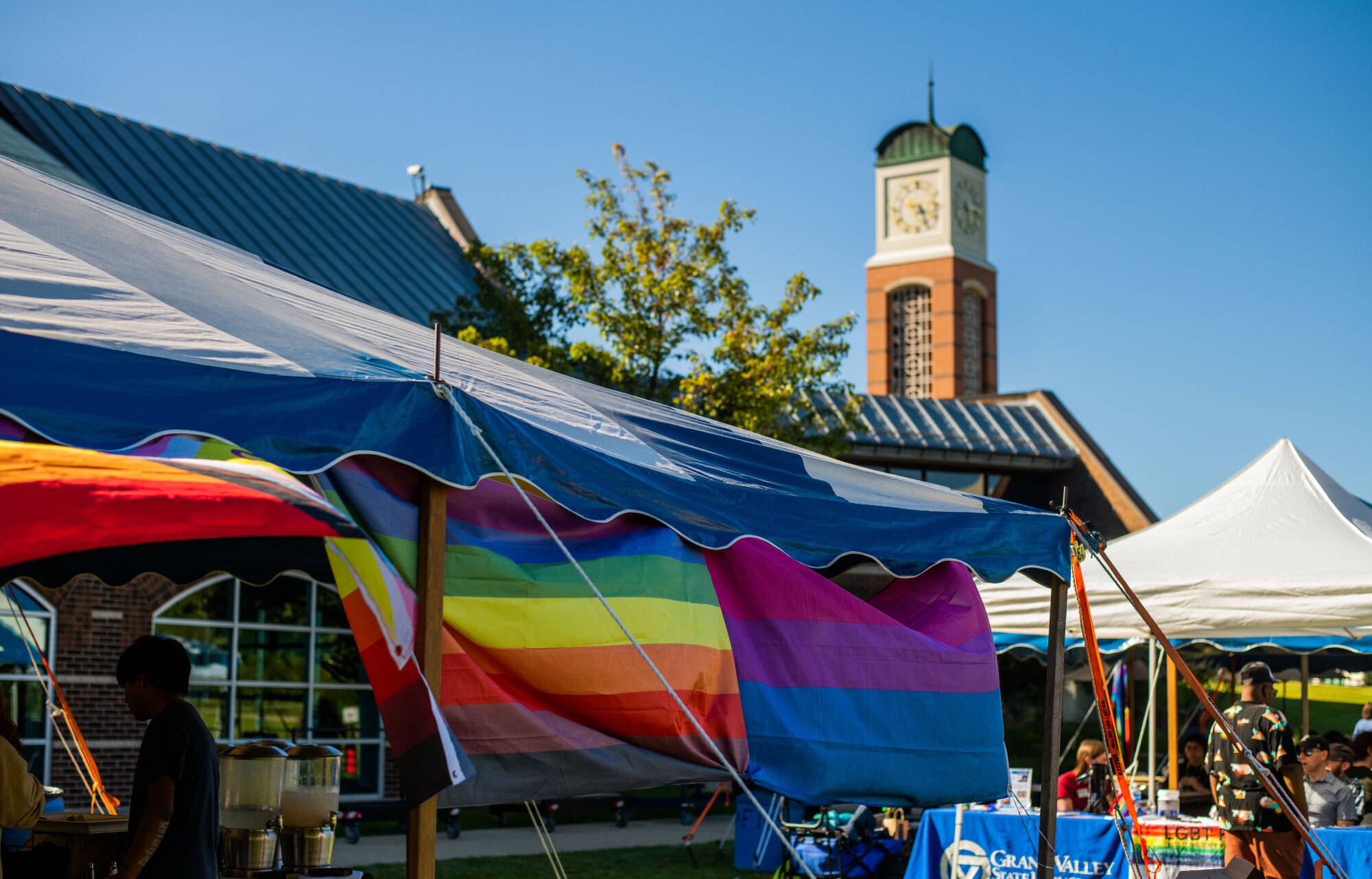 rainbow flags on tents at the rainbow social event